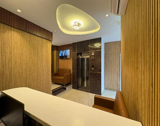 Lobby and lift area at Hotel Royal Inn